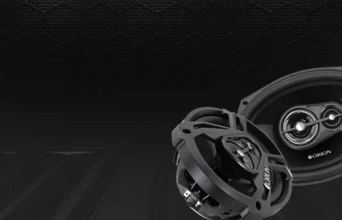 Car speakers with Orion logo on a dark background