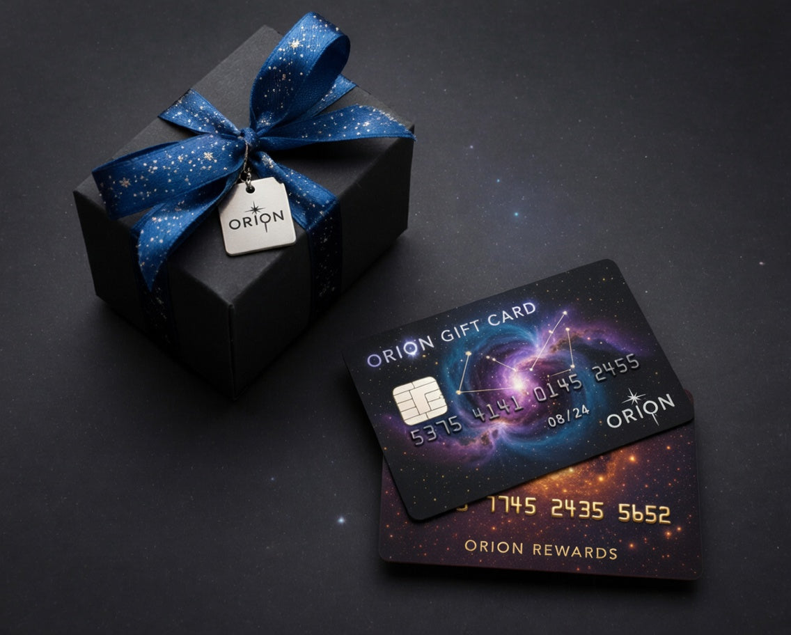 Orion gift card and black box with blue ribbon on a dark background