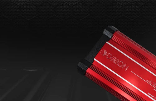 Red electronic device with 'Orion' branding on a dark textured background